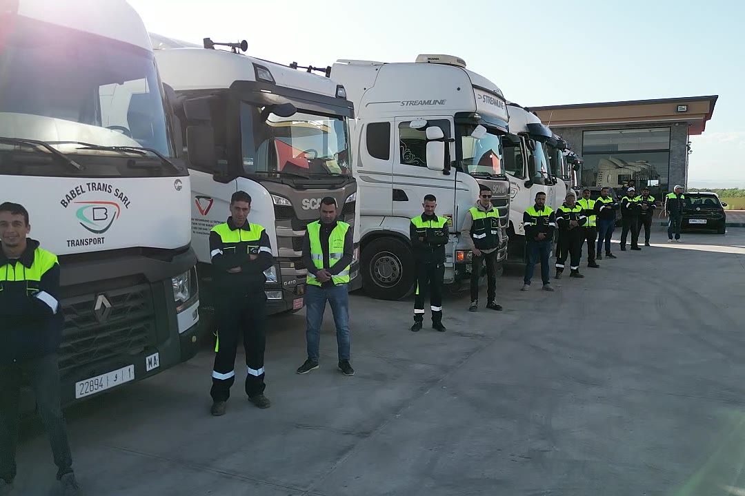 Babel Transport drivers in front of the trucks